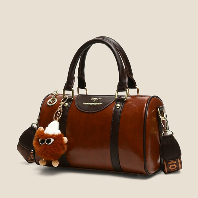 Women's Glossy Handbag with Playful Furry Pendant