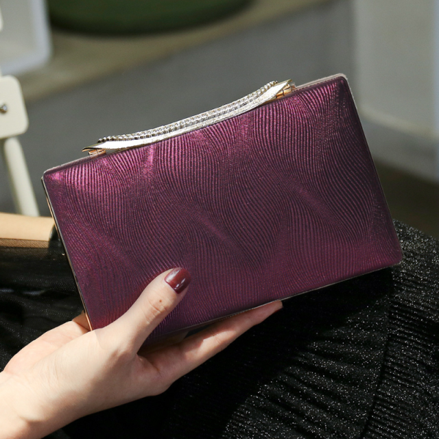 Elegant Shimmering Clutch with Rhinestone Handle