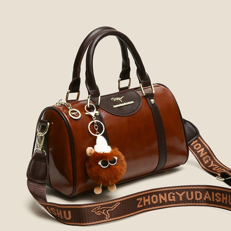 Women's Glossy Handbag with Playful Furry Pendant