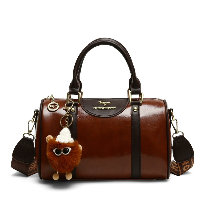 Women's Glossy Handbag with Playful Furry Pendant