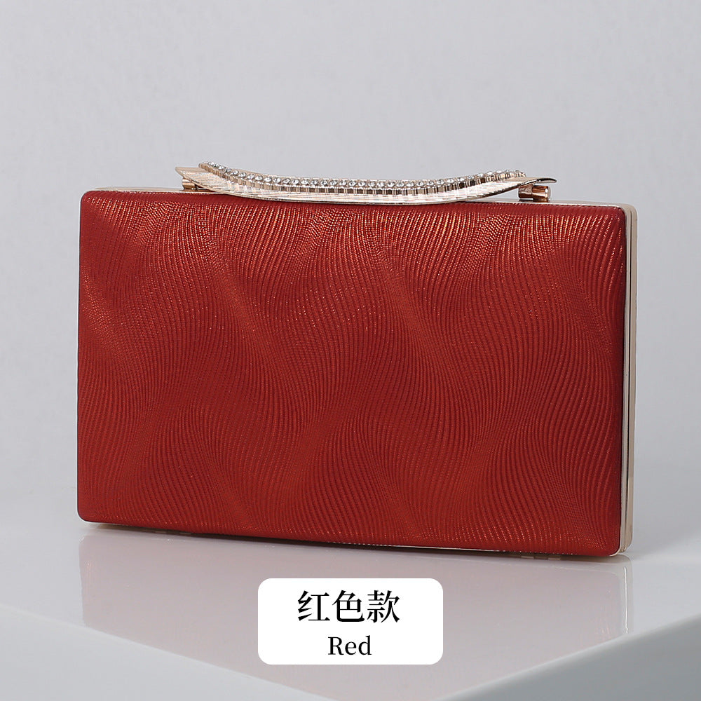 Elegant Shimmering Clutch with Rhinestone Handle