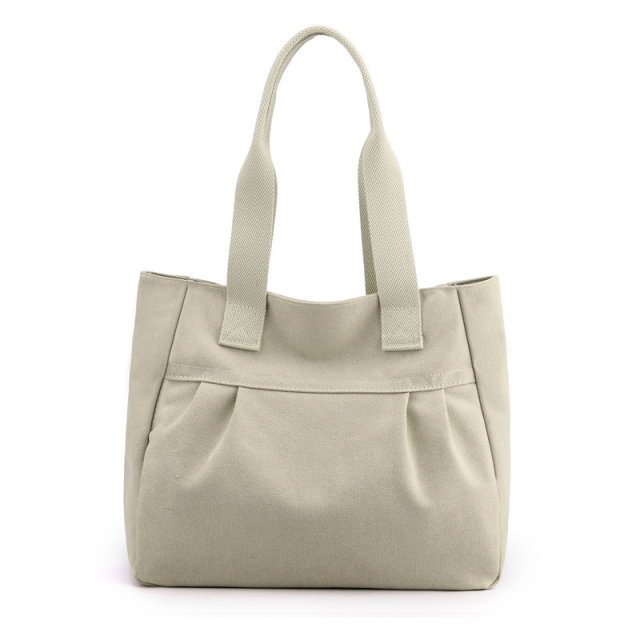 Minimalist canvas shoulder bag with sturdy straps in neutral tone

