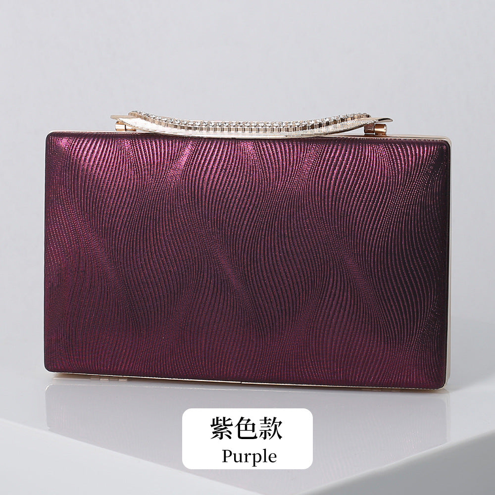 Elegant Shimmering Clutch with Rhinestone Handle