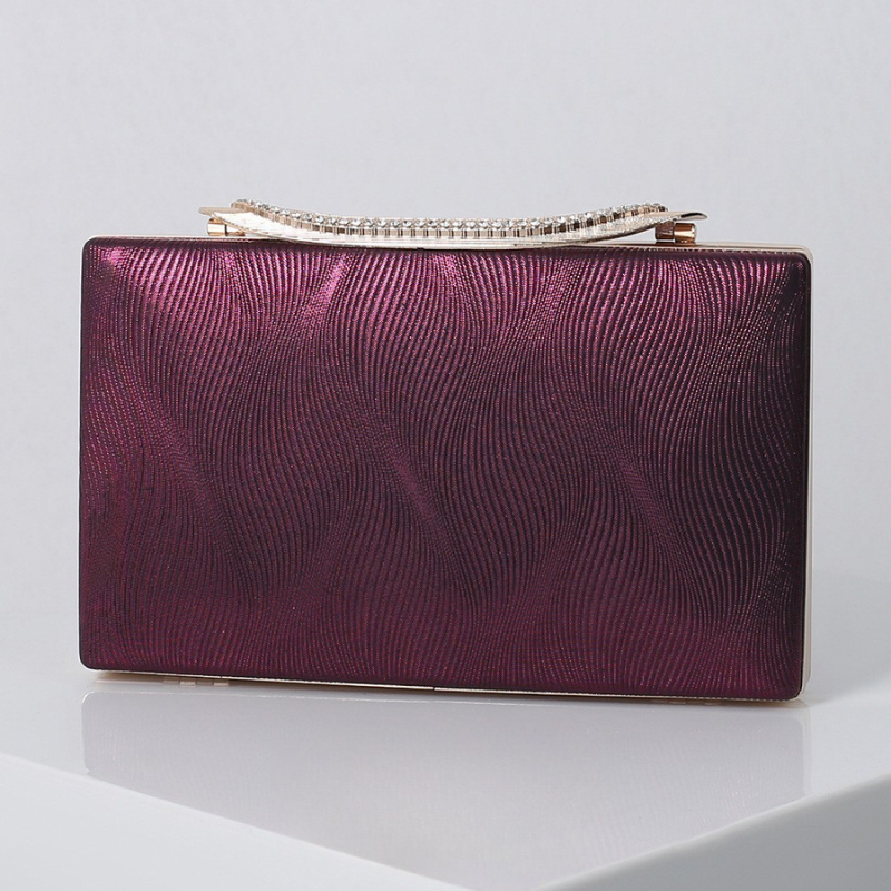 Elegant Shimmering Clutch with Rhinestone Handle