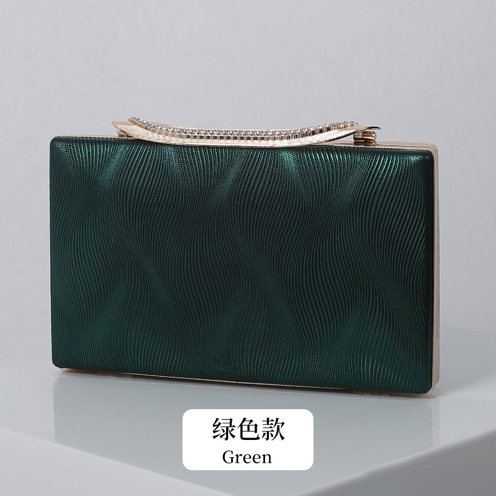 Elegant Shimmering Clutch with Rhinestone Handle